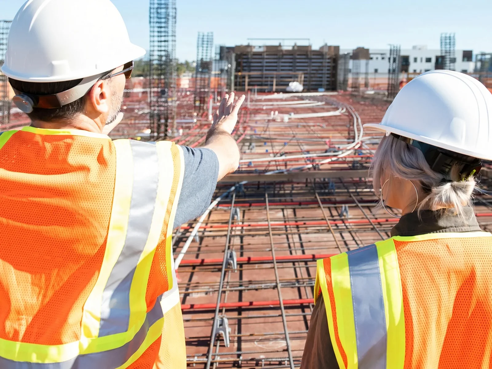 Construction crew in ANSI hi-vis safety workwear on site