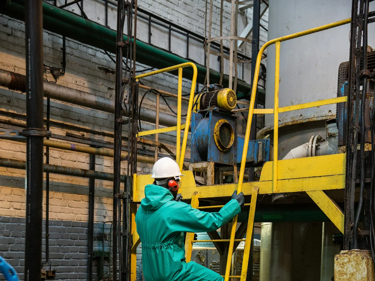 Oil and gas crew in FR and high-visibility coveralls