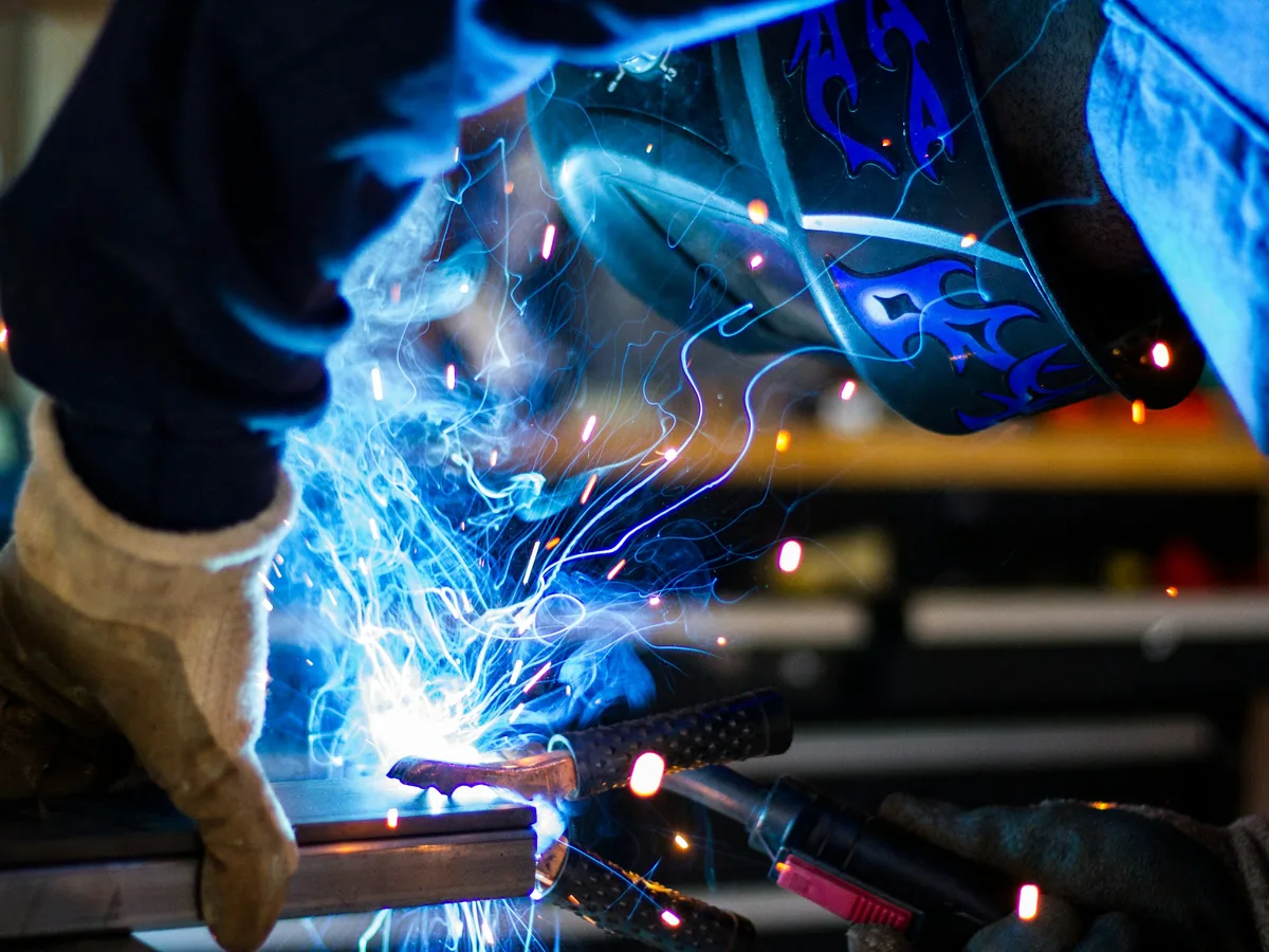 Welder in flame-resistant NFPA 2112 coveralls