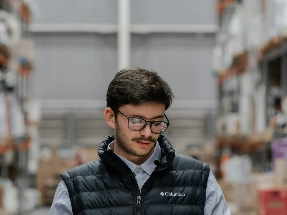 Field operations staff in branded work wear in a warehouse