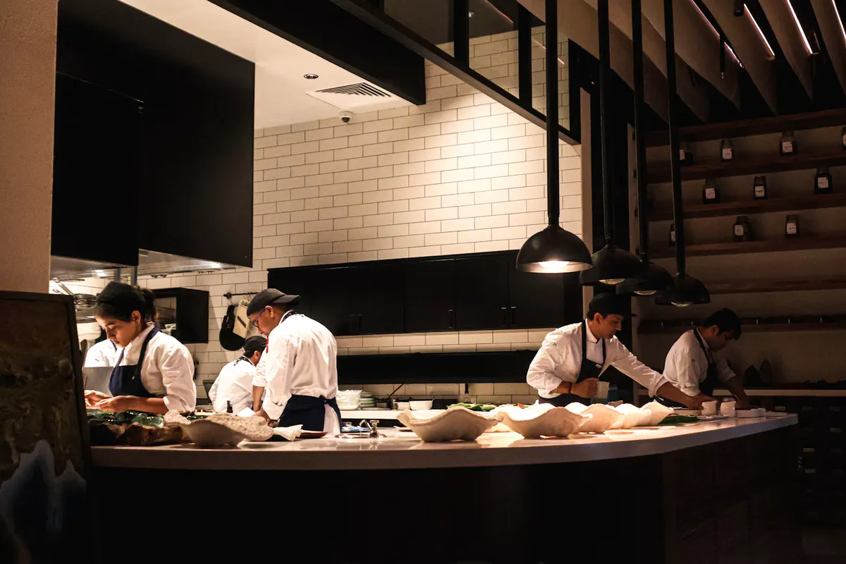 Hospitality uniform program — chef coats, aprons and front-of-house wear