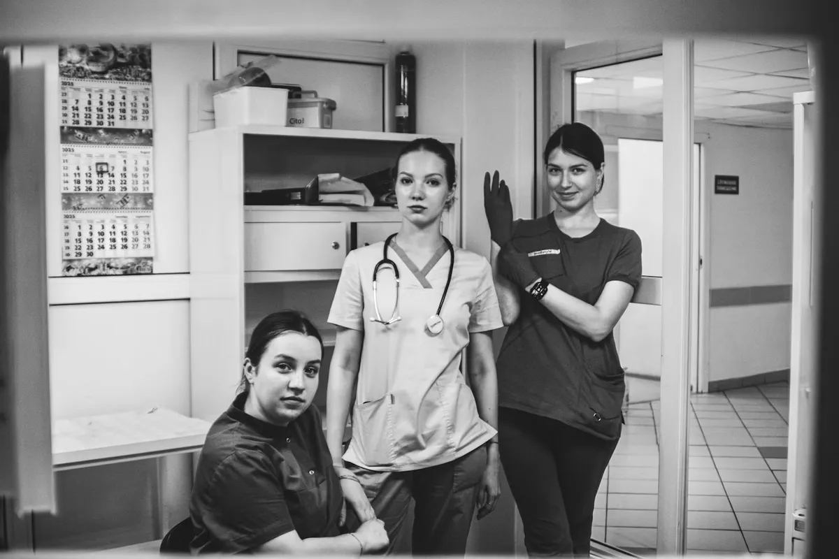 Multi-site medical uniforms manufactured to a color-locked spec